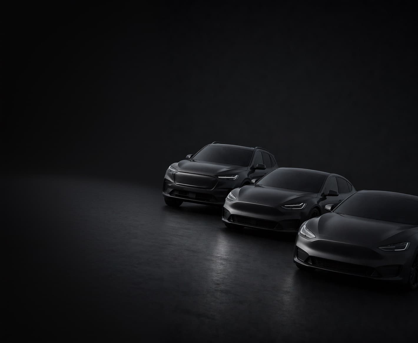 A lineup of MOMO rental cars in a dark studio