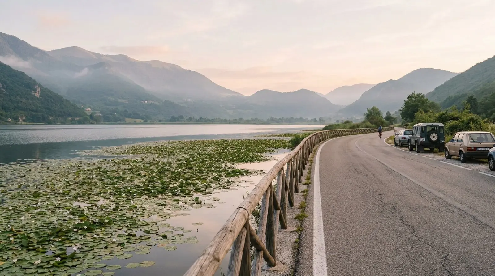 Cars queuing at a Balkan land border checkpoint between Albania and Montenegro on a summer morning